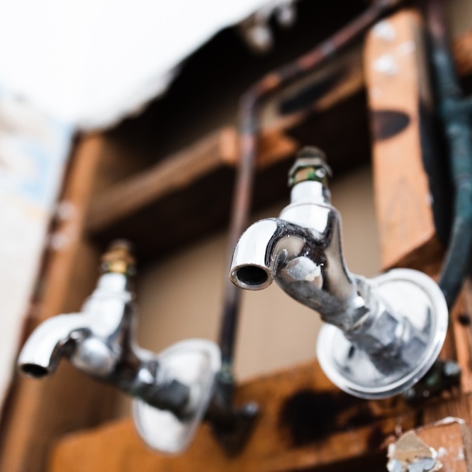 Two laundry room faucets.